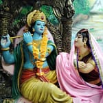 A statue of a man and woman sitting next to each other